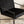 Fauteuil Rakel noir vu dans une pièce de vie lumineuse