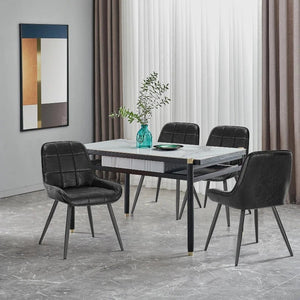 Chaises Velvet Noir en cuir autour d'une table de salle à manger