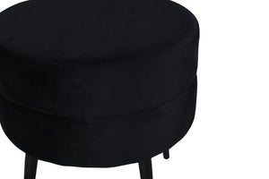 Pouf Pot noir utilisé comme repose-pieds