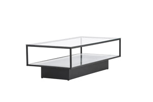 Table basse Maglehem noire utilisée comme table basse devant un canapé