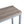 Table d'appoint Rise bois clair et gris dans une entrée industrielle