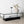 Table basse Maglehem 130 x 60 cm en verre et acier noir mat