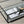 Table basse Maglehem noire dans un salon industriel