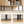 Buffet meuble de rangement avec portes coulissantes à lattes, armoire de cuisine avec pieds en acier, ton chêne